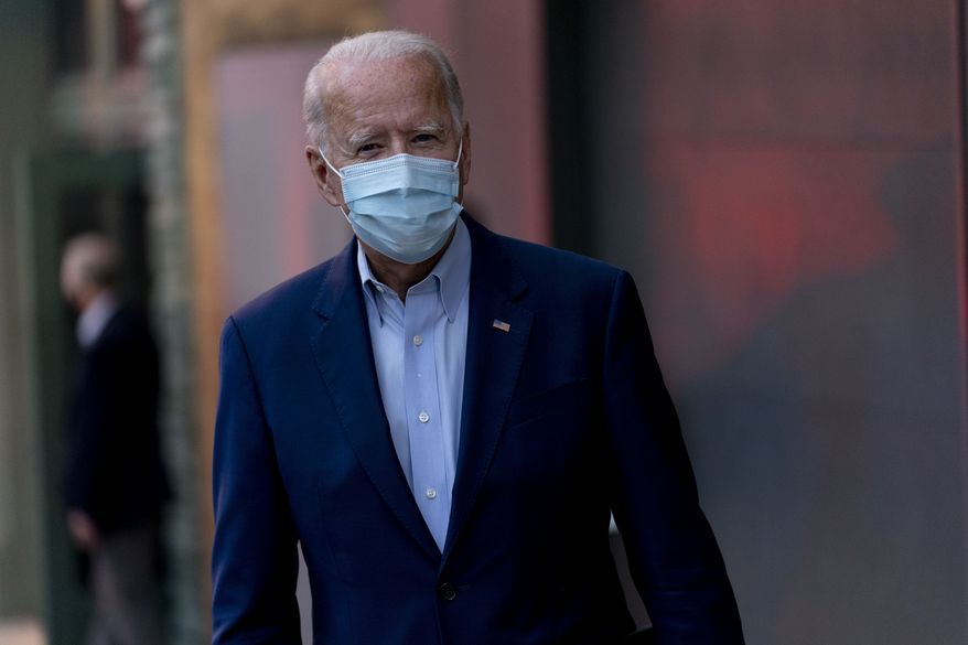 Democratic presidential candidate former Vice President Joe Biden speaks to members of the media as he leaves the Queen Theater in Wilmington, Del., Wednesday, Oct. 7, 2020. (AP Photo/Andrew Harnik)