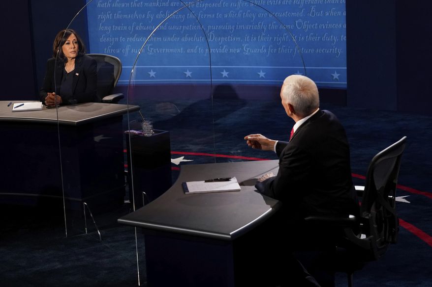 Democratic vice presidential candidate Sen. Kamala Harris, D-Calif., listens as Vice President Mike Pence answers a question during the vice presidential debate Wednesday, Oct. 7, 2020, at Kingsbury Hall on the campus of the University of Utah in Salt Lake City. (AP Photo/Morry Gash, Pool)