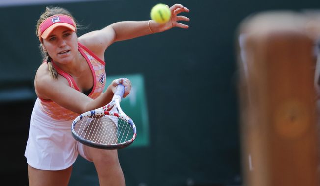 Sofia Kenin of the U.S. plays a shot against Danielle Collins of the U.S. in the quarterfinal match of the French Open tennis tournament at the Roland Garros stadium in Paris, France, Wednesday, Oct. 7, 2020. (AP Photo/Christophe Ena)