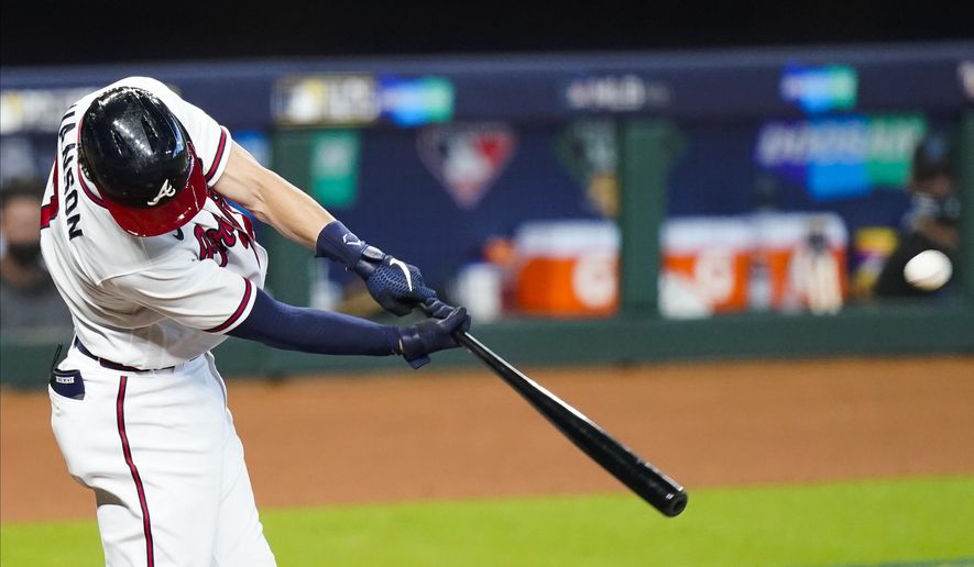 Atlanta Braves' Dansby Swanson hits a home run during the second inning in Game 2 of a baseball National League Division Series against the Miami Marlins Wednesday, Oct. 7, 2020, in Houston. (AP Photo/Eric Gay)