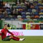 Portugal&#39;s Cristiano Ronaldo, right, sits on the pitch during the international friendly soccer match between Portugal and Spain at the Jose Alvalade stadium in Lisbon, Wednesday, Oct. 7, 2020. (AP Photo/Armando Franca)