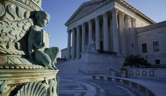 In this Oct. 5, 2020, photo the Supreme Court in Washington. Tech giants Google and Oracle are clashing at the Supreme Court in a copyright dispute worth billions and important to the future of software development. (AP Photo/J. Scott Applewhite)