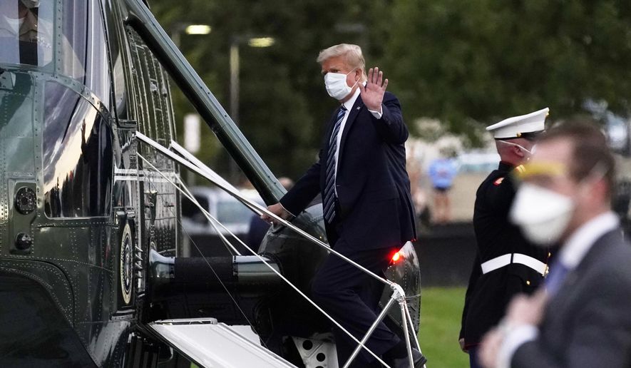 FILE - In this Oct. 5, 2020, file photo, President Donald Trump boards Marine One at Walter Reed National Military Medical Center after receiving treatment for coronavirus in Bethesda, Md. Ethics experts say the special treatment Trump received to access an experimental COVID-19 drug raises fairness issues and the public&#x27;s right to know more about Trump&#x27;s condition. (AP Photo/Evan Vucci, File)