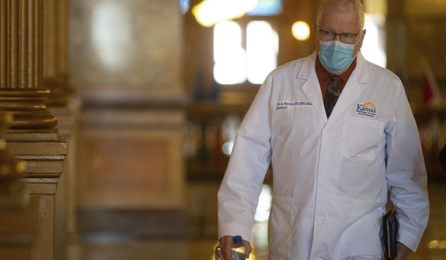 Lee Norman, Kansas secretary of health and environment, walks to his weekly press briefing Wednesday, Oct. 7, 2020, at the Statehouse in Topeka, Kan. (Evert Nelson/The Topeka Capital-Journal via AP)