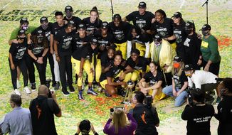 Members of the Seattle Storm organization celebrate after the team won basketball&#39;s WNBA Championship Tuesday, Oct. 6, 2020, in Bradenton, Fla. (AP Photo/Chris O&#39;Meara)