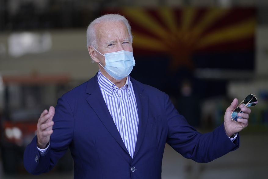 Democratic presidential candidate former Vice President Joe Biden speaks to members of the media before leaving Phoenix Sky Harbor International Airport, in Phoenix, Thursday, Oct. 8, 2020. (AP Photo/Carolyn Kaster)