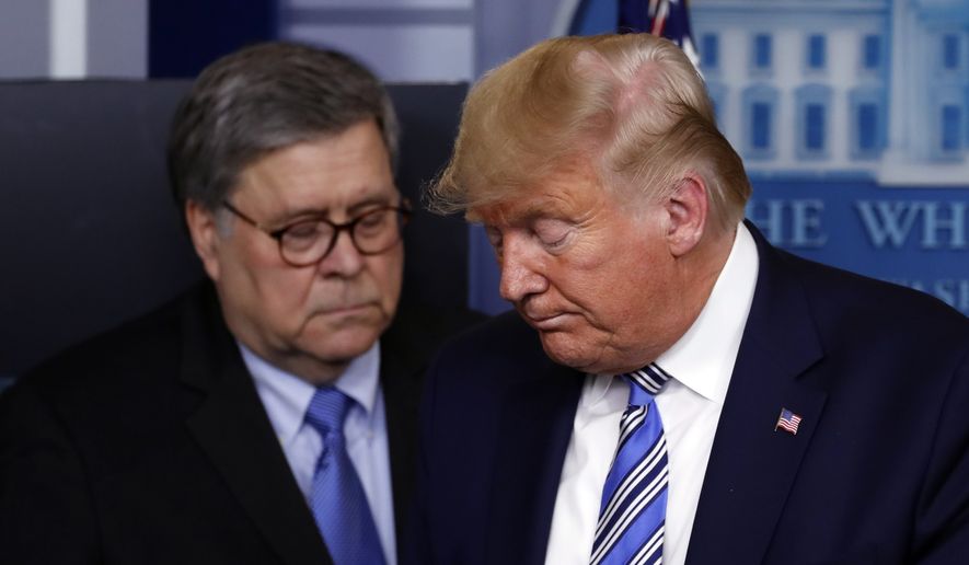 In this March 23, 2020, file photo President Donald Trump moves from the podium to allow Attorney General William Barr to speak about the coronavirus in the James Brady Briefing Room in Washington. The relationship between President Donald Trump and top ally Attorney General William Barr is fraying over the lack of splashy indictments so far in the Justice Department's investigation into the origins of the Russia probe, according to people familiar with the matter. (AP Photo/Alex Brandon, File)