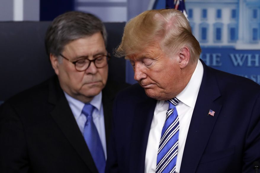 In this March 23, 2020, file photo President Donald Trump moves from the podium to allow Attorney General William Barr to speak about the coronavirus in the James Brady Briefing Room in Washington. The relationship between President Donald Trump and top ally Attorney General William Barr is fraying over the lack of splashy indictments so far in the Justice Department's investigation into the origins of the Russia probe, according to people familiar with the matter. (AP Photo/Alex Brandon, File)