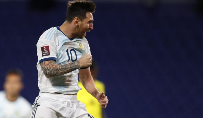 Argentina&#x27;s Lionel Messi celebrates scoring his side&#x27;s first goal during a qualifying soccer match against Ecuador for the FIFA World Cup Qatar 2022 at the Bombonera stadium in Buenos Aires, Argentina, Thursday, Oct. 8, 2020.(Agustin Marcarian/Pool via AP)