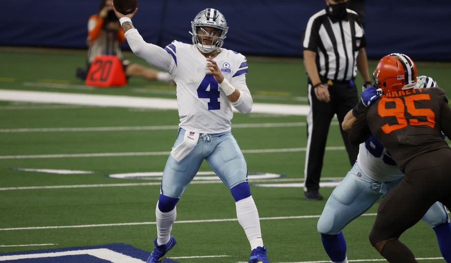 Dallas Cowboys quarterback Dak Prescott (4) throws a pass under pressure from Cleveland Browns defensive end Myles Garrett (95) in the second half of an NFL football game in Arlington, Texas, Sunday, Oct. 4, 2020. (AP Photo/Ron Jenkins)