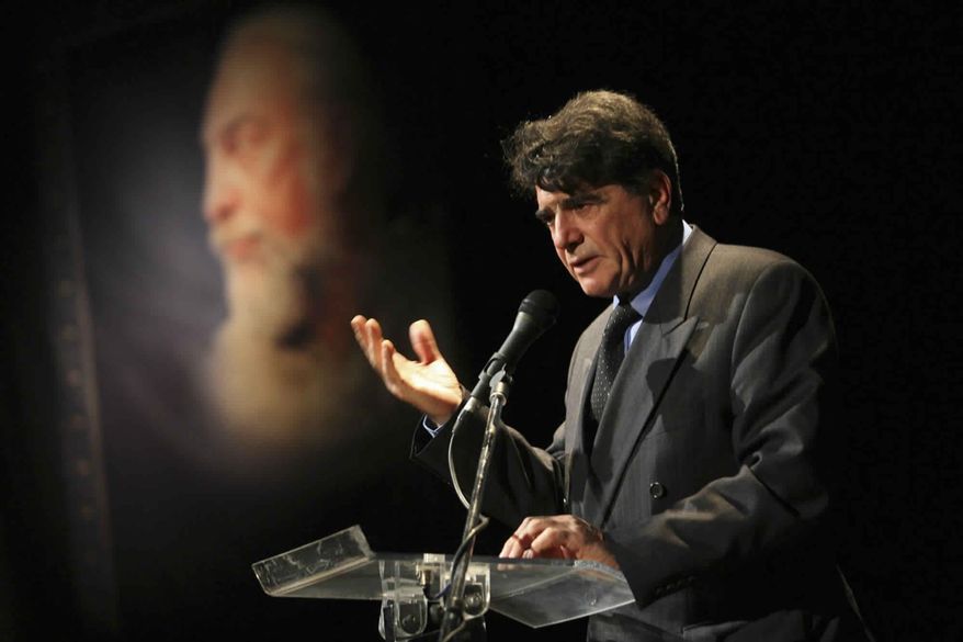 FILE - In this Nov. 11, 2009 file photo, legendary Iranian singer Mohammad Reza Shajarian, delivers a speech, at a ceremony commemorating the late musician Parviz Meshkatian in Tehran, Iran. Shajarian, whose distinctive voice quavered to traditional Persian music on state radio for years before supporting protesters following Iran’s contested 2009 election, has died, state TV reported Thursday, Oct. 8, 2020. He was 80. (AP Photo/Fars News Agency, Ali Shaigan, File)