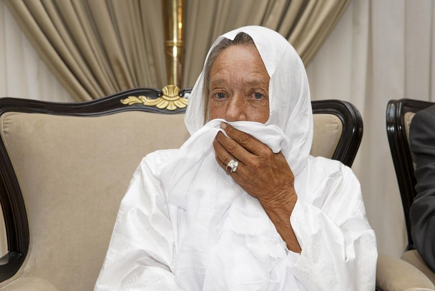 In this photo provided by the Mali Presidency, French ex-hostage Sophie Petronin is seen at the presidential palace after being released and flown to the capital Bamako, Mali, late Thursday, Oct. 8, 2020. A prominent Malian politician and three European hostages freed by Islamic extremists in northern Mali this week landed in the country's capital late Thursday where they held emotional reunions with family members and were greeted by government officials. (Mali Presidency via AP)