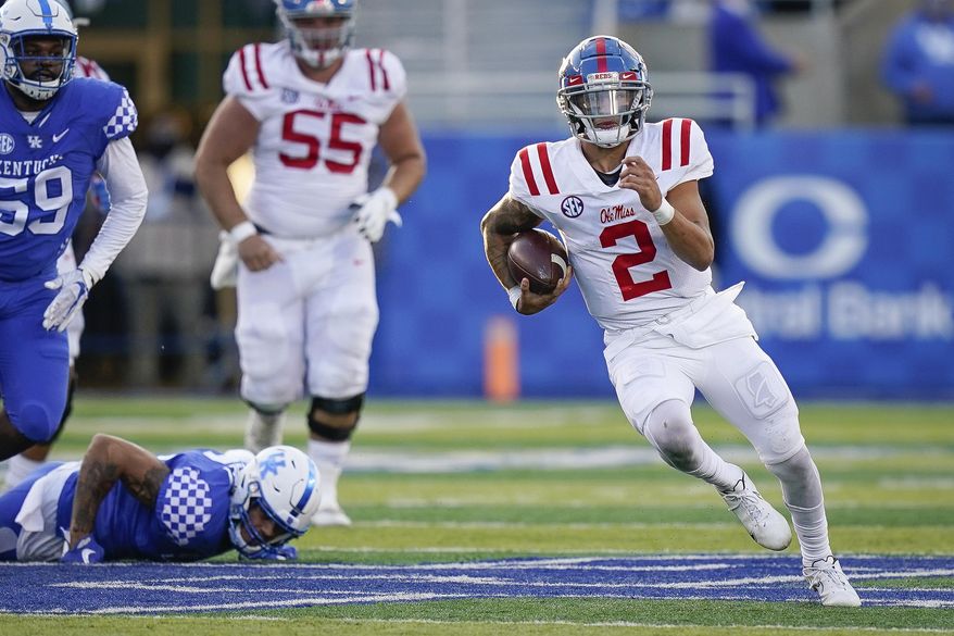 Mississippi quarterback Matt Corral (2) runs with the ball during the second half of an NCAA college football game against Kentucky, Saturday, Oct. 3, 2020, in Lexington, Ky. (AP Photo/Bryan Woolston)