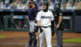 Miami Marlins&#39; Brian Anderson (15) reacts after striking out in the first inning in Game 3 of a baseball National League Division Series against the Atlanta Braves, Thursday, Oct. 8, 2020, in Houston. (AP Photo/David J. Phillip)