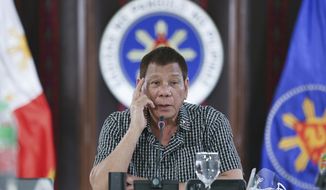 In this photo provided by the Malacanang Presidential Photographers Division, Philippine President Rodrigo Duterte speaks at the Malacanang presidential palace in Manila, Philippines on Thursday Oct. 8, 2020. The Philippine president warned Thursday he will intercede and resolve a leadership row in the House of Representatives if the impasse threatens to stall the passage of next year&#39;s budget during the coronavirus crisis. (Albert Alcain/Malacanang Presidential Photographers Division via AP)