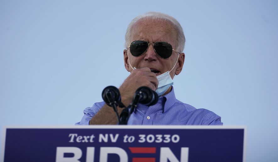 Democratic presidential candidate former Vice President Joe Biden speaks at a Las Vegas Drive-In campaign event at Southeast Career Technical Academy , Friday, Oct. 9, 2020, in Las Vegas. (AP Photo/Carolyn Kaster)