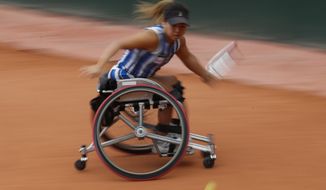 Japan&#39;s Yui Kamiji plays a shot against Japan&#39;s Momoko Ohtani in the women&#39;s wheelchair final match of the French Open tennis tournament at the Roland Garros stadium in Paris, France, Friday, Oct. 9, 2020. (AP Photo/Alessandra Tarantino)