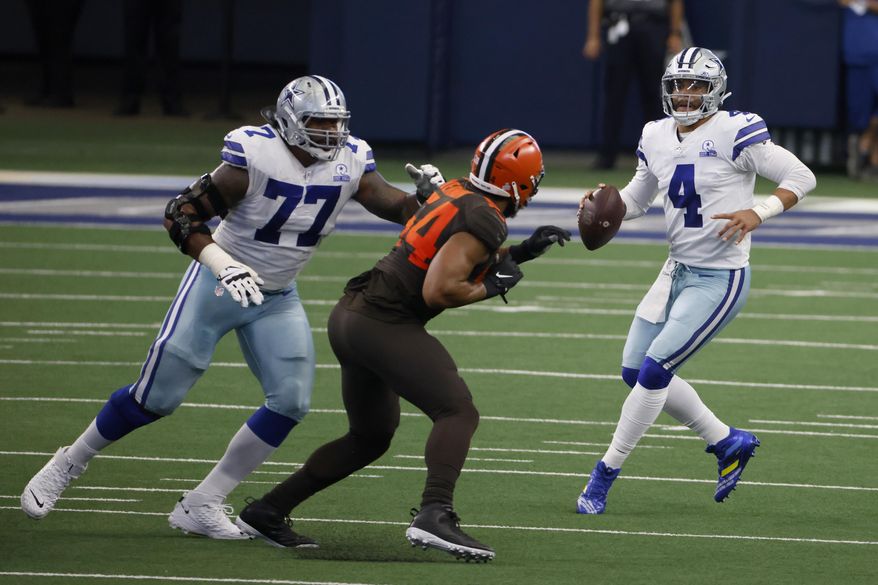 Dallas Cowboys offensive tackle Tyron Smith (77) defends against pressure from Cleveland Browns defensive end Olivier Vernon (54) as quarterback Dak Prescott (4) looks to make a pass in the first half of an NFL football game in Arlington, Texas, Sunday, Oct. 4, 2020. (AP Photo/Ron Jenkins)