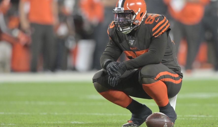 FILE - In this Sept. 22, 2019, file photo, Cleveland Browns defensive tackle Larry Ogunjobi (65) reacts during an NFL football game against the Los Angeles Rams in Cleveland. The Browns will be without one of their best defensive players Sunday against Indianapolis as Ogunjobi will sit out with an abdominal injury. (AP Photo/David Richard, File)
