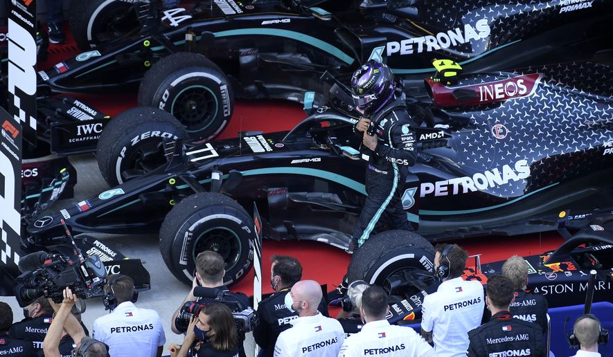 Mercedes driver Lewis Hamilton of Britain walks by his crew after placing third in the Russian Formula One Grand Prix, at the Sochi Autodrom circuit, in Sochi, Russia, Sunday, Sept. 27, 2020. (Kirill Kudryavtsev, Pool via AP)