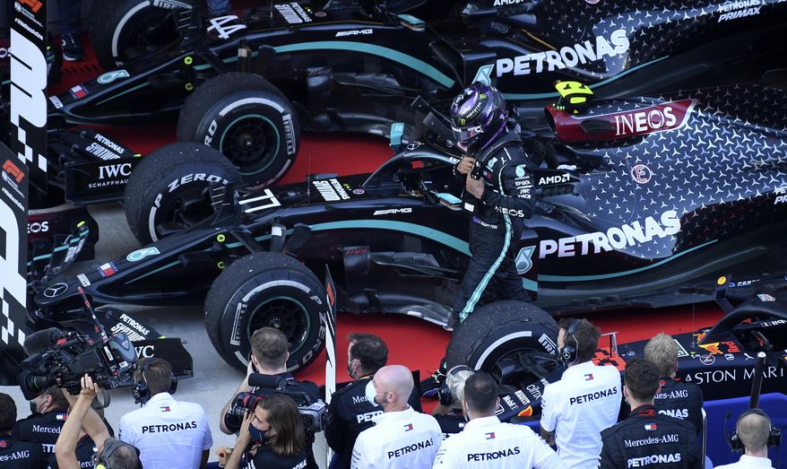 Mercedes driver Lewis Hamilton of Britain walks by his crew after placing third in the Russian Formula One Grand Prix, at the Sochi Autodrom circuit, in Sochi, Russia, Sunday, Sept. 27, 2020. (Kirill Kudryavtsev, Pool via AP)