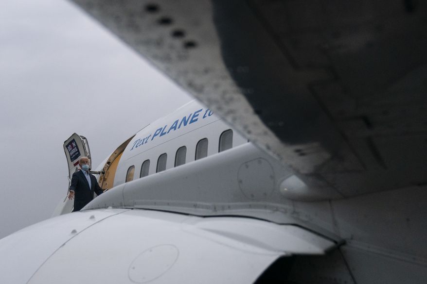 Democratic presidential candidate former Vice President Joe Biden boards his campaign plane at Erie International Airport, Saturday, Oct. 10, 2020, in Erie, Pa., en route to Wilmington, Del. (AP Photo/Carolyn Kaster)