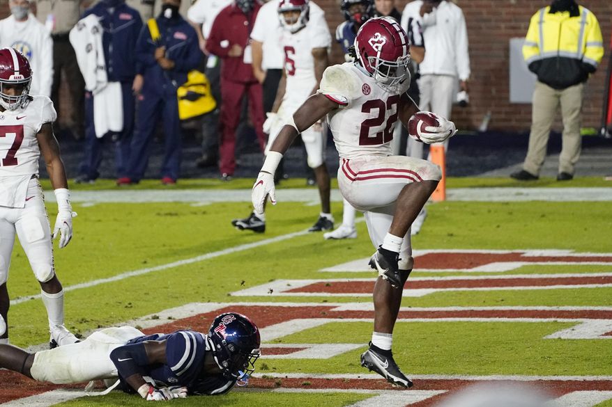 Alabama running back Najee Harris (22) dances after breaking a Mississippi tackle and scoring a touchdown during the first half of an NCAA college football game in Oxford, Miss., Saturday, Oct. 10, 2020. (AP Photo/Rogelio V. Solis)