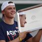 Switzerland&#39;s Dominic Stephan Stricker holds the trophy after winning the junior men&#39;s final match of the French Open tennis tournament against Switzerland&#39;s Leandro Riedi at the Roland Garros stadium in Paris, France, Saturday, Oct. 10, 2020. (AP Photo/Alessandra Tarantino)