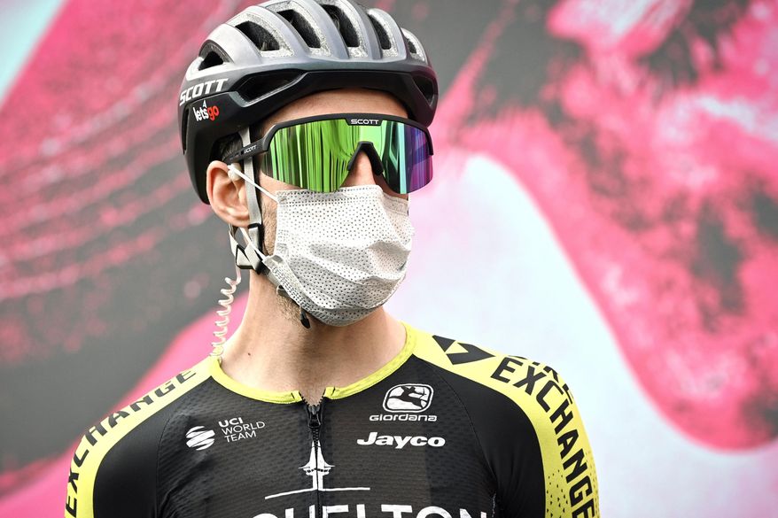 Britain's Simon Yates wears a face mask prior to the fifth stage of the Giro d'Italia cycling race from Mileto to Camigliatello Silano, Wednesday, Oct. 7, 2020. Overall contender Simon Yates has withdrawn from the Giro d’Italia after testing positive for the coronavirus, his Mitchelton-Scott team announced before the eighth stage, Saturday, Oct. 10, 2020. (Massimo Paolone/LaPresse via AP)