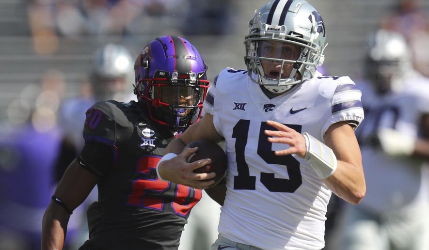 Kansas State quarterback Will Howard (15) carries the ball for an 80-yard run as TCU safety La'Kendrick Van Zandt (20) pursues in the first quarter of an NCAA college football game Saturday, Oct. 10, 2020, in Arlington, Texas. (AP Photo/Richard W. Rodriguez)