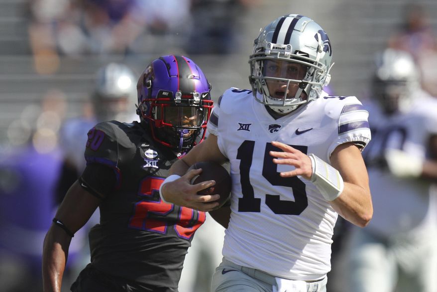 Kansas State quarterback Will Howard (15) carries the ball for an 80-yard run as TCU safety La'Kendrick Van Zandt (20) pursues in the first quarter of an NCAA college football game Saturday, Oct. 10, 2020, in Arlington, Texas. (AP Photo/Richard W. Rodriguez)