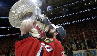 FILE - In this June 15, 2015, file photo, Chicago Blackhawks&#39; goalie Corey Crawford kisses the Stanley Cup Trophy after defeating the Tampa Bay Lightning in Game 6 of the NHL hockey Stanley Cup Final series in Chicago. The past few weeks have seen several recent Stanley Cup winners get rid of members of their championship core. The Blackhawks moved on from Corey Crawford, the Washington Capitals did the same with Braden Holtby, the Pittsburgh Penguins traded fellow goalie Matt Murray and forward Patric Hornqvist and the St. Louis Blues signing Torey Krug means captain Alex Pietrangelo will sign elsewhere.  (AP Photo/Nam Y. Huh, File)