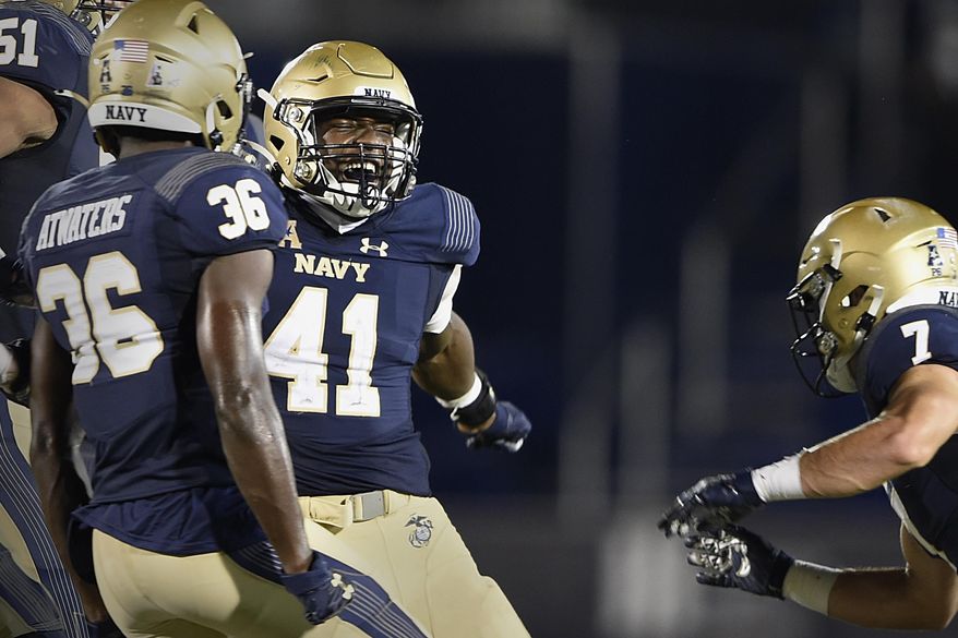 Navy's Terrell Adams (41) celebrates after stopping a 2-point conversion attempt by Temple during an NCAA college football game Saturday, Oct. 10, 2020, in Annapolis, Md. Navy won 31-29. (AP Photo/Gail Burton)