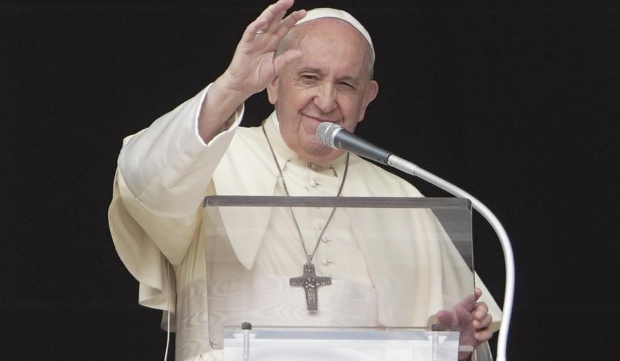 FILE -- In this Sept. 20, 2020 file photo, Pope Francis delivers his blessing as he recites the Angelus noon prayer from the window of his studio overlooking St.Peter's Square, at the Vatican. The pontiff on Saturday, Oct. 10 recorded a video message to a TED conference on climate change, that will be released later Saturday night. (AP Photo/Andrew Medichini)