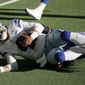 Dallas Cowboys quarterback Dak Prescott (4) is tackled by New York Giants cornerback Logan Ryan, rear, in the second half of an NFL football game in Arlington, Texas, Sunday, Oct. 11, 2020. Prescott suffered a lower right leg injury on the play. (AP Photo/Michael Ainsworth)