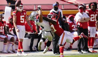 Kansas City Chiefs cornerback Rashad Fenton, right, breaks up a pass intended for Las Vegas Raiders fullback Alec Ingold, left, during the second half of an NFL football game, Sunday, Oct. 11, 2020, in Kansas City. (AP Photo/Jeff Roberson)