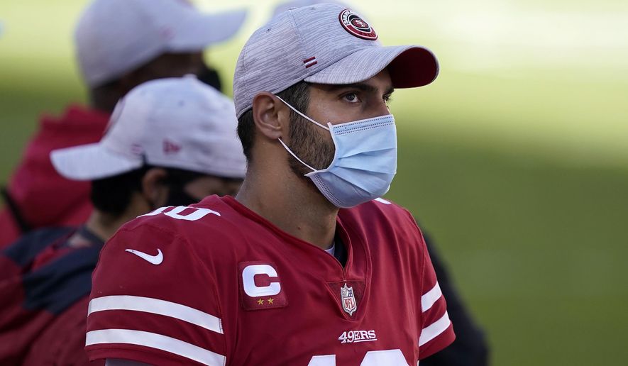 San Francisco 49ers quarterback Jimmy Garoppolo watches from the sideline during the second half of an NFL football game against the Miami Dolphins in Santa Clara, Calif., Sunday, Oct. 11, 2020. (AP Photo/Tony Avelar)