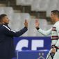 France&#39;s Kylian Mbappe and Portugal&#39;s Cristiano Ronaldo, right, greet each other at the end of the UEFA Nations League soccer match between France and Portugal at the Stade de France in Saint-Denis, north of Paris, France, Sunday, Oct. 11, 2020. (AP Photo/Thibault Camus)