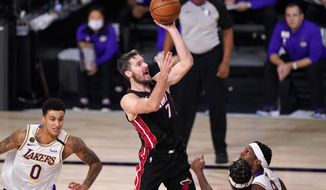 Miami Heat&#x27;s Goran Dragic (7) shoots during the second half in Game 6 of basketball&#x27;s NBA Finals against the Los Angeles Lakers Sunday, Oct. 11, 2020, in Lake Buena Vista, Fla. (AP Photo/Mark J. Terrill)