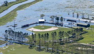 A flooded recreational area is seen in the aftermath of Hurricane Delta Saturday Oct. 10, 2020, in Iowa, La. (Bill Feig/The Advocate via AP, Pool)