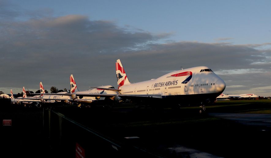 Retired British Airways Boeing 747-400 parked at Cotsworld Airport in Kemble, England, Sunday, Oct. 11, 2020. The retirement of the Jumbo Jet fleet was brought forward as a result of the impact the COVID-19 pandemic had on the airline and the aviation sector. (AP Photo/Frank Augstein)