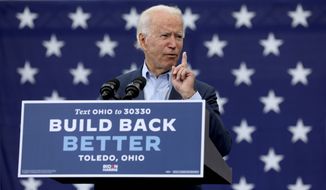 Presidential candidate Joe Biden speaks at a drive-in rally at UAW Local 14 in Toledo, Ohio, on Monday, Oct. 12, 2020. (Lori King/The Blade via AP)