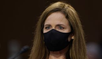 Supreme Court nominee Amy Coney Barrett arrives for her confirmation hearing before the Senate Judiciary Committee, Monday, Oct. 12, 2020, on Capitol Hill in Washington. (AP Photo/Susan Walsh, Pool)