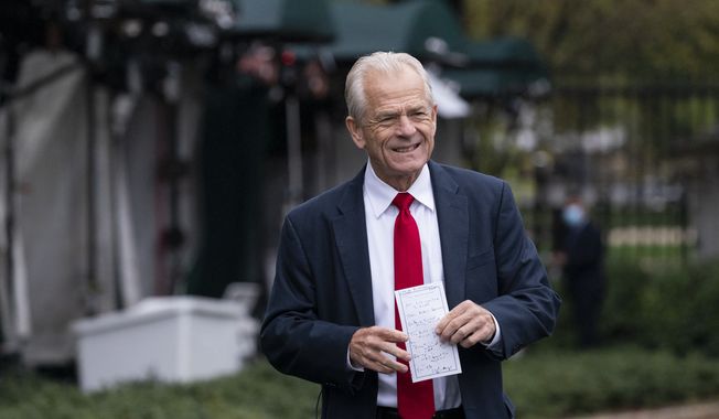 White House trade adviser Peter Navarro holds his notes after a television interview at the White House Monday, Oct. 12, 2020, in Washington. (AP Photo/Alex Brandon)