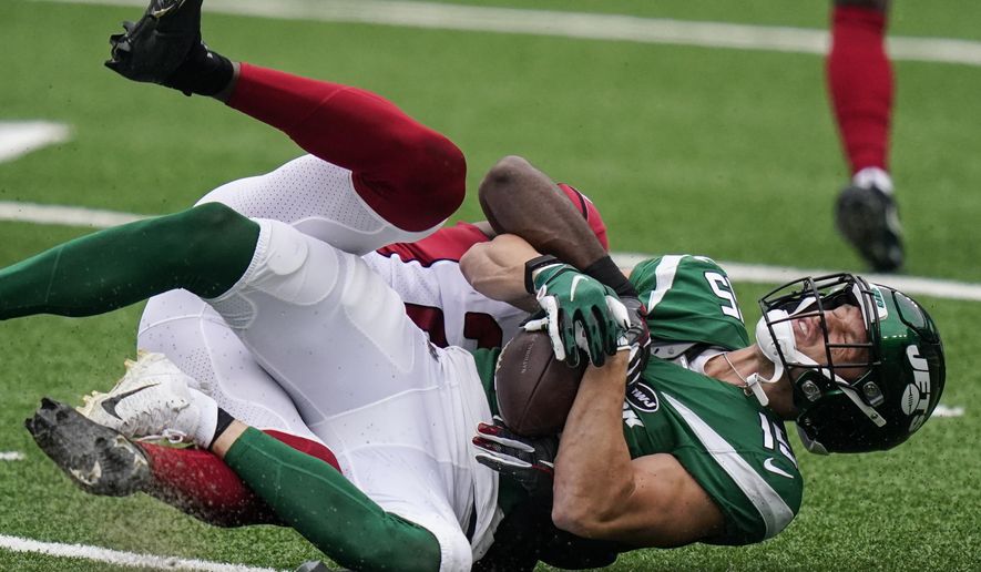 New York Jets wide receiver Chris Hogan (15) is tackled by Arizona Cardinals cornerback Patrick Peterson during the first half of an NFL football game, Sunday, Oct. 11, 2020, in East Rutherford. (AP Photo/Frank Franklin II)