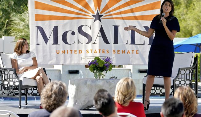 Former U.N. Ambassador Nikki Haley, right, campaigns on behalf of U.S Sen. Martha McSally, R-Ariz., Monday, Oct. 12, 2020, in Scottsdale, Ariz. (AP Photo/Matt York)