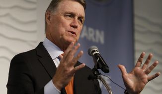 FILE - In this Aug. 6, 2019, file photo, Sen. David Perdue, R-Ga., speaks during a Kiwanis Club of Atlanta luncheon. Republican Sen. David Perdue of Georgia is set to face Democrat Jon Ossoff in the first debate of their U.S. Senate race Monday afternoon, Oct. 12, 2020. (AP Photo/Andrea Smith, File)