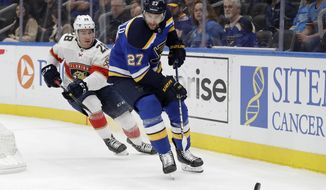 FILE - In this March 9, 2020, file photo, St. Louis Blues&#39; Alex Pietrangelo (27) and Florida Panthers&#39; Aleksi Saarela (28) chase after the puck during the first period of an NHL hockey game in St. Louis. The Vegas Golden Knights have agreed to terms on a $61.6 million, seven-year contract with top free agent Pietrangelo, a person with direct knowledge of the move tells The Associated Press. (AP Photo/Jeff Roberson, File)