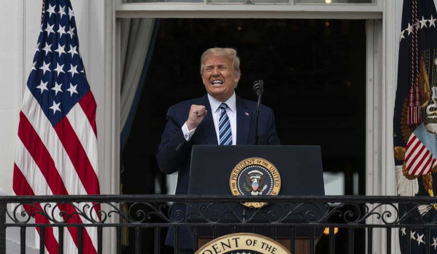 President Donald Trump speaks from the Blue Room Balcony of the White House to a crowd of supporters, Saturday, Oct. 10, 2020, in Washington. (AP Photo/Alex Brandon)