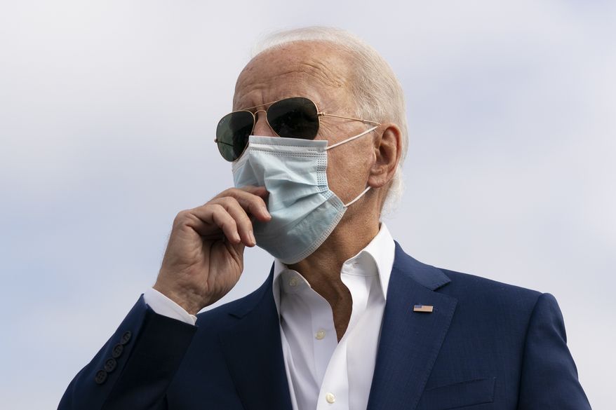 Democratic presidential candidate former Vice President Joe Biden speaks to media before boarding his campaign plane at New Castle Airport, in New Castle, Del., Tuesday Oct. 13, 2020, en route to Florida. (AP Photo/Carolyn Kaster)